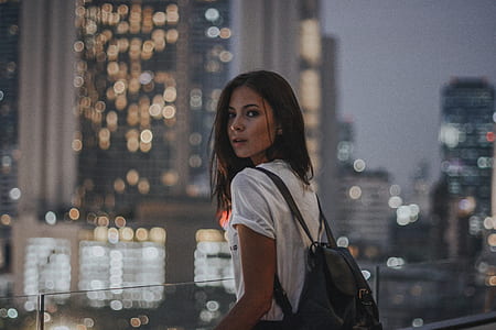 woman carrying black backpack thumbnail