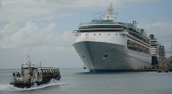 white ship on water at daytime thumbnail