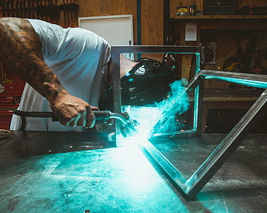man wearing welding helmet molding frame thumbnail
