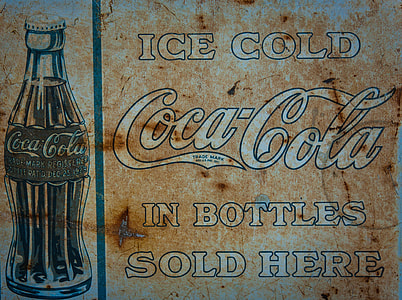brown and white Ice Cold Coca-Cola In Bottles Sold Here signage thumbnail