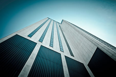 white and black high rise concrete building thumbnail