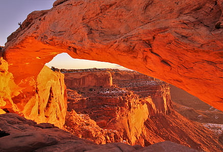 brown rock formation under white sky during daytime photography thumbnail