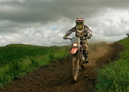 man riding on motocross dirt bike thumbnail