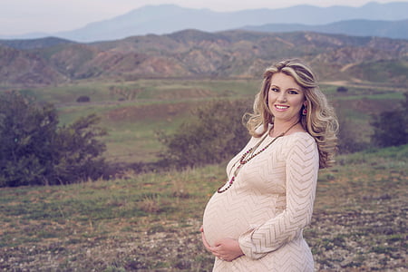 brown haired pregnant woman during daytime thumbnail
