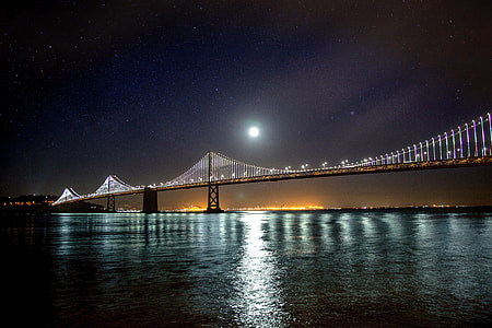 Moon and Stars over the Oakland-San Francisco Bay Bridge at night in California thumbnail