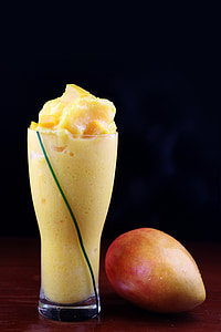 drinking glass with mango shake thumbnail