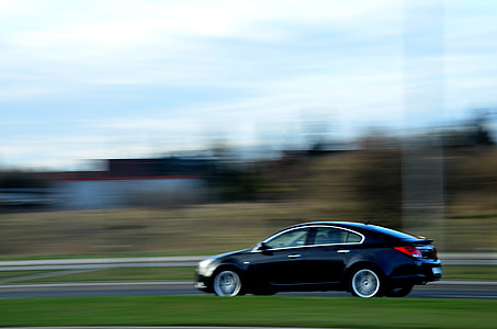 black sedan in time lapse photography thumbnail