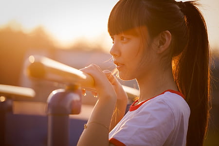woman wearing white and red crew-neck shirt thumbnail