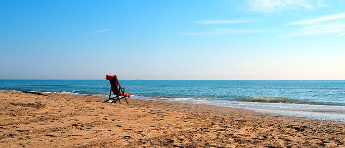 camping chair on beach shore thumbnail