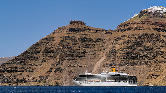 cruise ship beside cliff thumbnail