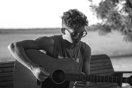 man playing acoustic guitar thumbnail