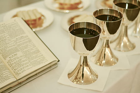 three gold goblets with wines thumbnail