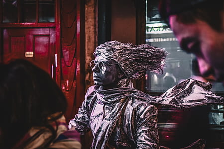 man wearing gray scarf statue thumbnail
