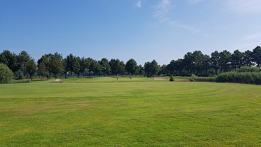 panoramic photography of golf course thumbnail