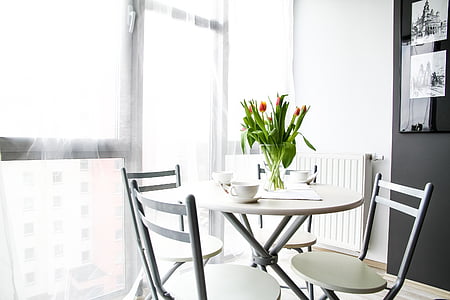 round white dining table with four ladderback chairs thumbnail