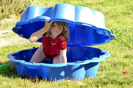 girl inside blue sandbox thumbnail