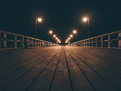 brown wooden dock during night time thumbnail
