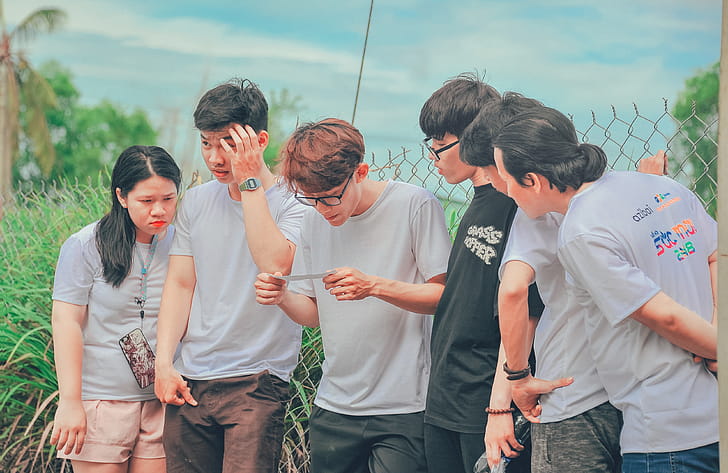 Five Men and 1 Women Wearing Crew-neck T-shirts at Daytime