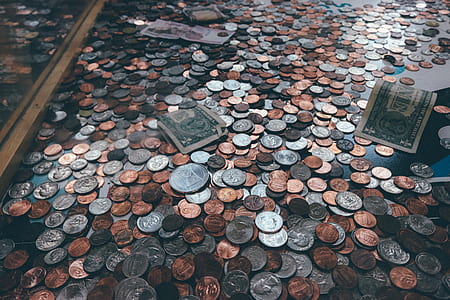 coins and banknotes on black surface thumbnail