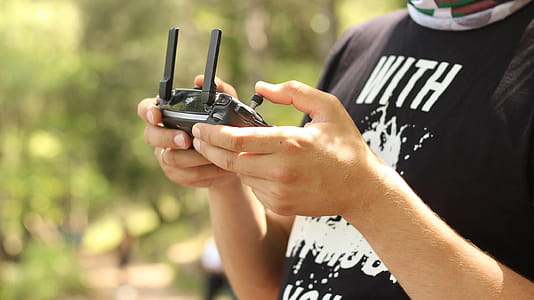 Person Holding Radio Controller at Daytime thumbnail