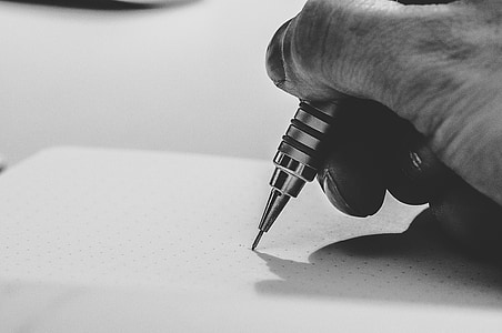 person holding pen thumbnail