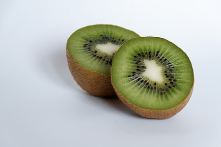 sliced kiwi fruits on white surface thumbnail