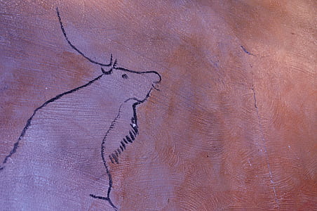 animal carved in brown concrete surface thumbnail
