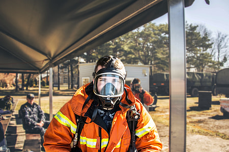 firefighter taking picture during daytime thumbnail