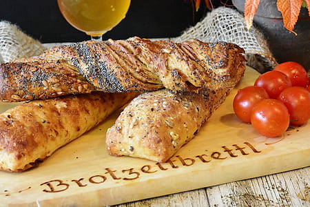 brown bread on brown wooden chopping board thumbnail