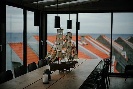 brown sail ship scale model on table thumbnail