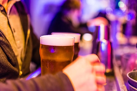 person in front of full drinking glasses thumbnail
