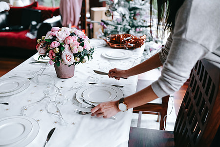 Hands Decorating Christmas Table thumbnail