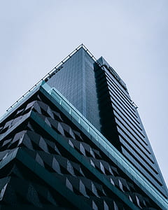 low-angle photography of black high-rise building thumbnail