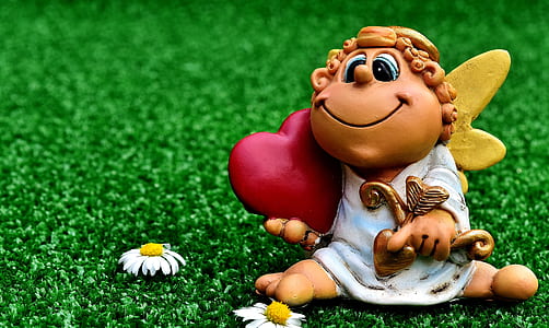 cherub character toy on focus photo thumbnail