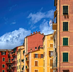 concrete buildings under blue cloudy sky thumbnail