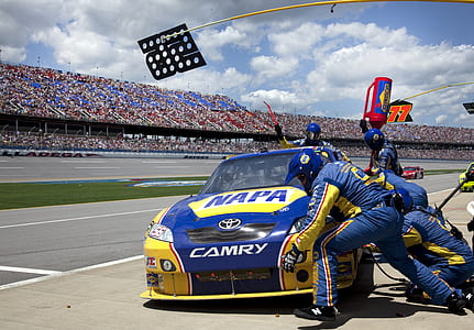 people changing tire of racing car thumbnail