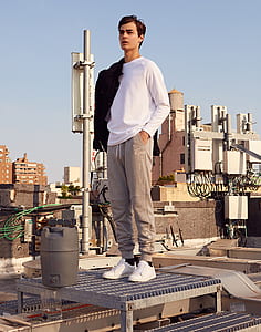 person standing on silver steel board thumbnail