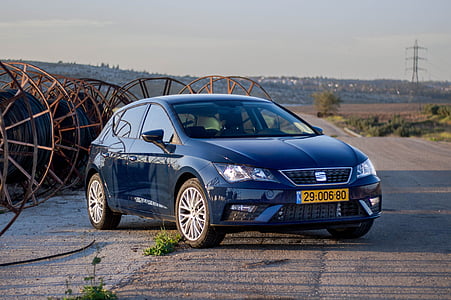 blue SEAT Ibiza 5-door hatchback near large cable reels at daytime thumbnail
