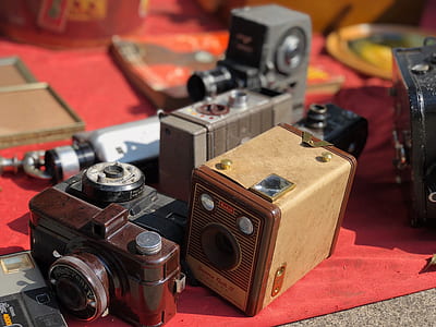 three vintage cameras on surface thumbnail