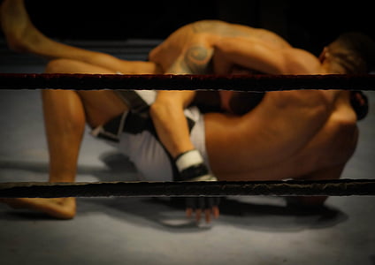 two men grappling each other thumbnail