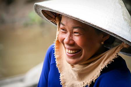 photo of woman in blue top and wearing hat thumbnail