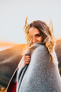 woman covered with coat thumbnail