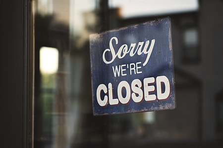 photo of blue wooden Sorry we're Closed signage thumbnail