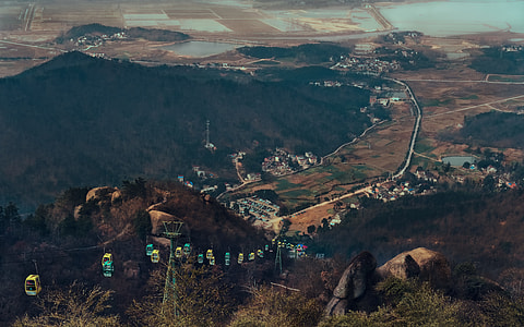 aerial photography of cable cars on mountain thumbnail