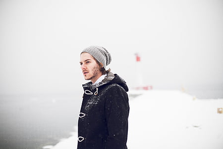 man wearing gray beanie while taking selfie thumbnail