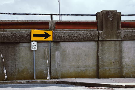 yellow and black arrow street sign thumbnail