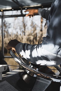 person riding vehicle while pointing on glass window during daytime thumbnail