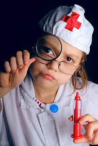child wearing doctor costume holding syringe toy thumbnail