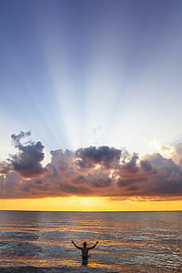 person standing on body of water thumbnail