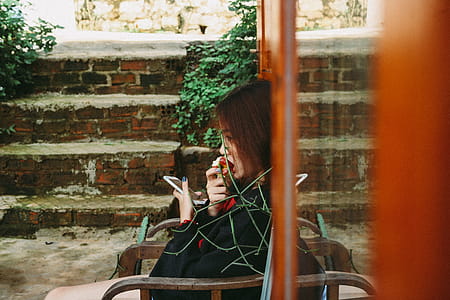 Woman Holding White Smartphone thumbnail